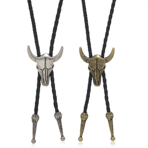 Retro punk style bull skull bolo tie with black braided leather rope in silver and bronze