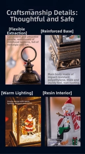 Detail of vintage Christmas lantern with warm LED light, durable base and resin Santa figure