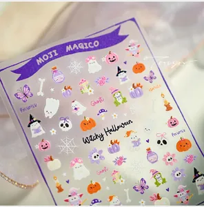 Macro detail of Halloween nail art stickers with pumpkin, ghost and witch hat illustrations