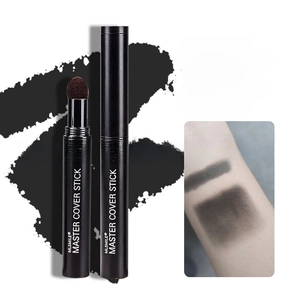 Macro view of natural black hairline contour stick with skin swatch comparison