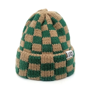 Close-up of green and brown checkerboard knit beanie with LIZHI STYLE brand label