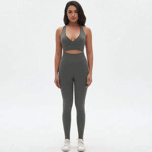 Detail view of charcoal grey seamless yoga set with cross V-neck bra and high waist leggings