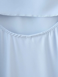 Detail shot of halter neckline stitching and light blue satin fabric texture for dresses