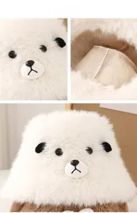 Macro detail of plush white faux fur fabric and cute bear face embroidery on bucket hat