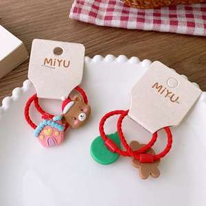 Set of 2 cute Christmas hair ties for kids featuring reindeer, bears and trees