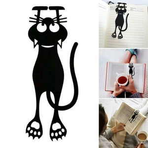 Detail view of a 3D black cat bookmark showing creative cartoon silhouette in a book
