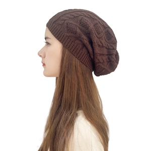 Dark brown cable knit slouchy beanie for men and women with warm textured winter design