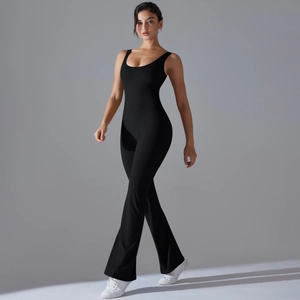 Detail of black flare leg yoga jumpsuit with hollow back and compression fabric