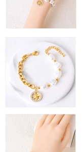 Close-up of pearl splice bracelet with gold star pendant and sparkling zircon details
