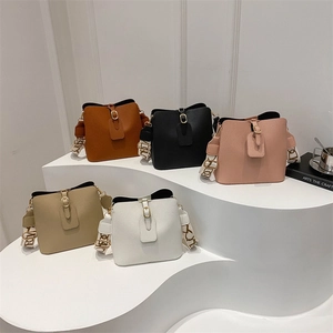 Minimalist large bucket bags in brown, black, and khaki with stylish wide shoulder straps