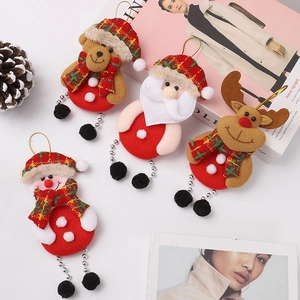 Plush Christmas ornaments featuring Santa, snowman, reindeer, and bear figures on a table