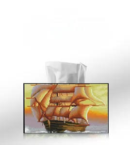 Detail showing sunset sailing ship DIY diamond painting on a modern tissue box holder