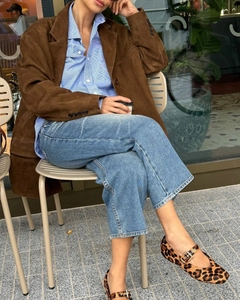Chic vintage suede blazer styled with striped shirt and leopard print shoes