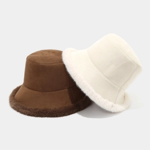 Thick plush bucket hats for winter in brown and beige colors with warm faux fur trim
