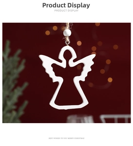 White wooden angel ornament with jute rope and bead against warm festive Christmas background