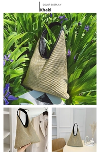 Detail of khaki woven tote bag with black leather handle and intricate mesh texture