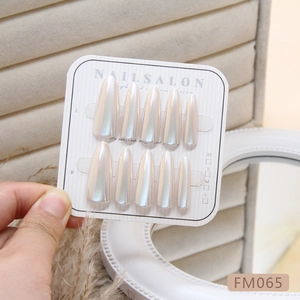 Handmade pearlescent cat eye press-on nails in long almond shape with gradient finish