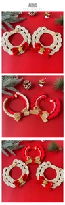 Detail view of handmade crochet Christmas pet collars with bows and star ornaments