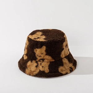 Detailed view of plush lamb wool bucket hat with brown bear patterns and soft texture