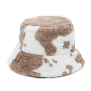 Detailed close-up of fluffy faux fur bucket hat with brown and beige cow print texture