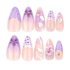 French almond press-on nails featuring purple gradient, 3D flowers and pearl accents