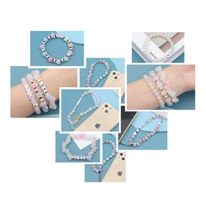Detailed close-up of macaron acrylic heart beads and colorful DIY bracelet charms