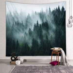 Detail view of a lush green forest tapestry hanging on a white brick wall in a cozy room