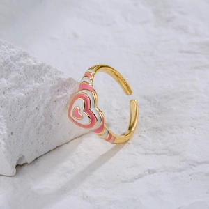 Pink and white enamel heart ring in 18K gold plated copper with an adjustable open design