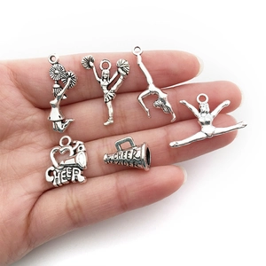 Antique silver cheerleading charms set featuring cheer leader pendants and athlete poses