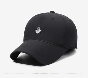 Detail of classic black baseball cap with textured fabric and crown shield embroidery