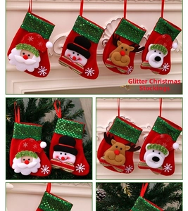 Close-up of mini Christmas stockings with sequins, Santa, snowman, elk and bear designs