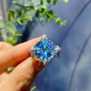 Square cut blue aquamarine ring with heavy silver setting and micro-pave crystals
