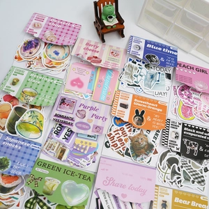 Flat lay of diverse retro sticker collection including sweets and animals for journaling