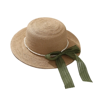 Women's flat top straw hat with white pearl beads and green silk ribbon for sun protection
