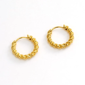 Detailed macro view of 18K gold-plated twisted rope hoop earrings in polished steel