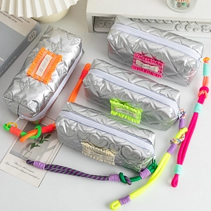 Quilted silver large capacity pencil case with colorful labels and braided carry handle