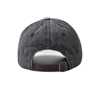 Detail of washed cotton baseball cap with adjustable leather strap and bronze buckle