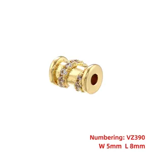 Detailed view of gold-plated hollow wheel bead with inlaid cubic zirconia, 5mm by 8mm