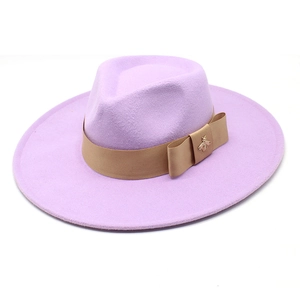 Detail of lavender fedora hat showing khaki ribbon and gold bee metal accessory