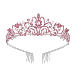 Silver bridal crown with pink crystals and floral patterns on white background