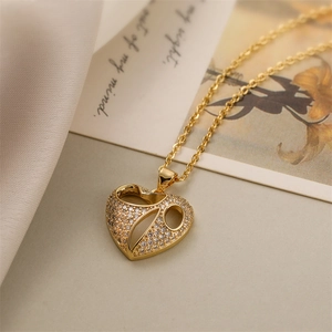 Macro detail of gold-plated hollow heart pendant with pave cubic zirconia and O-chain