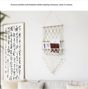 Detail of bohemian hand-woven cotton macrame wall hanging shelf with tassel accents