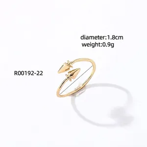 Macro detail of gold open ring with dual cone design showing 1.8cm diameter dimension