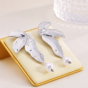 Elegant irregular leaf earrings in silver stainless steel with white pearl drops