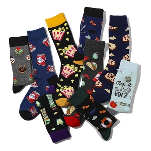 Close-up of novelty cotton crew socks featuring colorful popcorn and beer motifs