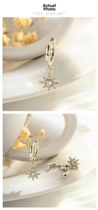 Détail de boucles d'oreilles tournesol or café avec zircone micro-incrustée