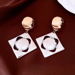 Retro geometric drop earrings with gold semicircle and silver square frame on brown silk