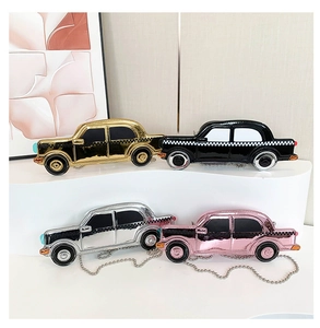 Car-shaped chain bags in gold, silver, pink, and black with shiny metallic finish