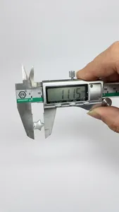 Detail showing precise measurement of a star-shaped jewelry charm using a digital caliper