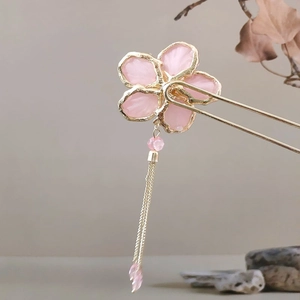 Pink cherry blossom hair pin with gold tassels and traditional Chinese style aesthetics